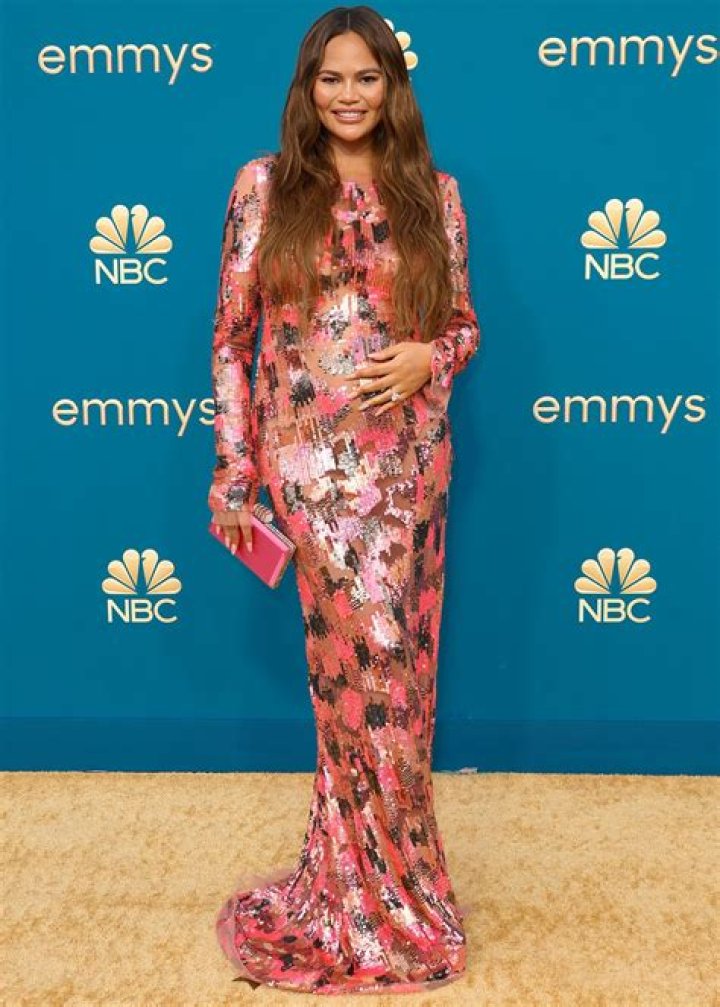 
Pregnant Chrissy Teigen Shows Baby Bump in Pink Off-the-Shoulder Gown at White House State Dinner 